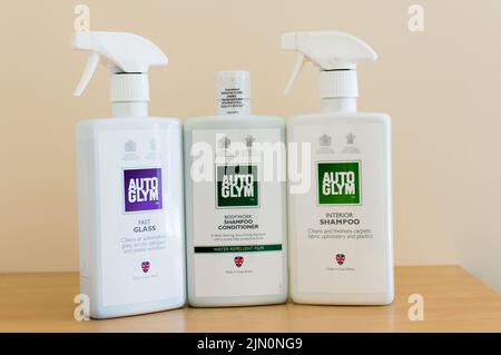 Three AutoGlym car care cleaning products on table Stock Photo