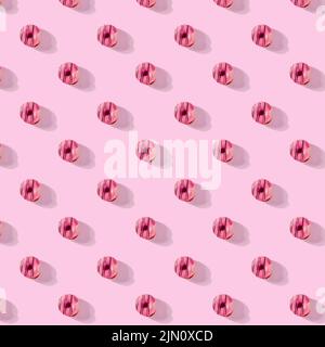 pattern made of Freshly baked donuts for breakfast on a pink background . Sweet background. Bakery, baking concept. Stock Photo