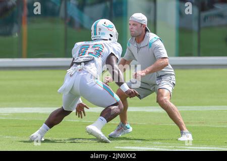 Miami Dolphins wide receiver Wes Welker (83) of the Dolphins tries to slip  the grasp of the New York Jets' Rashad Washington in the fourth quarter.  The Jets defeated the Dolphins, 20-17