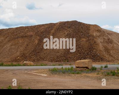 Pile of orange slag rocks stones in Falu Copper Mine World Heritage Sweden Stock Photo