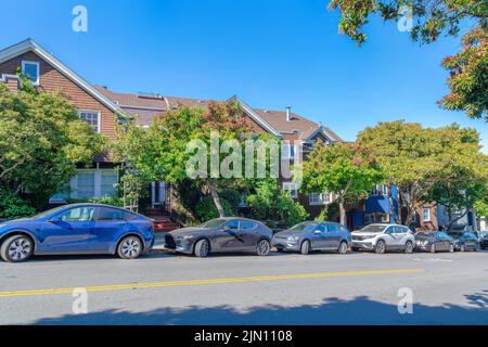 Adjacent houses on a sloped neighborhood at San Francisco, California ...