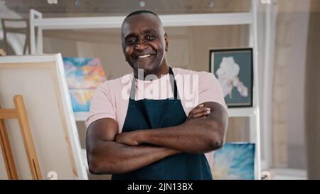 Portrait close up male happy old 50s painter art teacher African American happy elder senior middle-aged man artist talented designer creator posing Stock Photo