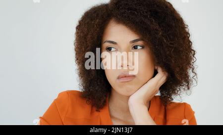 Sad worried African woman ponder thinking problem feeling anxiety depression upset frustrated lonely curly haired pensive girl lady grief troubled Stock Photo