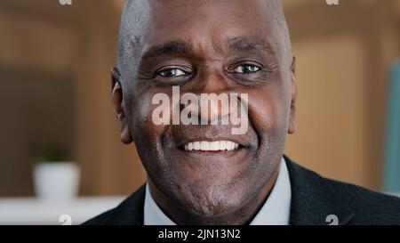 Close up happy male face 60s businessman elderly African American man grandpa satisfied client dentistry service ophthalmology clinic smiling toothy Stock Photo