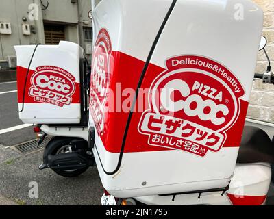 Pizza Cooc delivery moped scooters. Pizza Cooc is a popular pizza chain in Japan. Stock Photo
