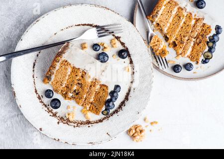 Carrot cake slice with blueberries, top view Stock Photo