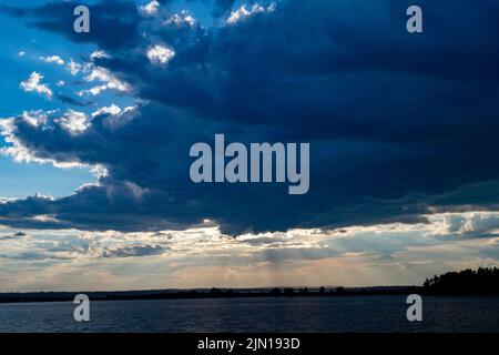 July 8, 2022.  7:21pm.  Storm clouds on the way.  View from Barnes Island.  Casco Bay, Maine.  Rain Storm Series Stock Photo