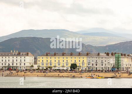 Llandudno north Wales united kingdom 01 August 2022 victorian hotels along the front at the welsh seaside resort llandudno, showing tourists on the be Stock Photo