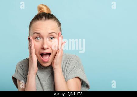 surprised shocked amazed woman open mouth Stock Photo