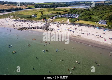 Rosscarbery, West Cork, Ireland. 8th Aug, 2022. The Warren Beach in Rosscarbery was very busy today with people taking a dip into the water to cool off on a day with temperatures hitting 21C. Credit: AG News/Alamy Live News Stock Photo