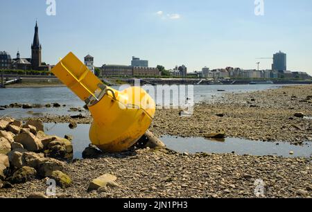 Low stream gauge of river rhine in germany.Water shortage, drought, climate change and global warming concept. Stock Photo