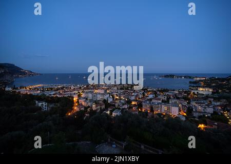 Panorama of the seaside town of Beaulieu-sur-Mer, French Riviera - Côte d'Azur, at dusk, with Saint-Jean-Cap-Ferrat on the right Stock Photo