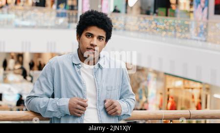 Portrait young 30s confident successful African American calm relaxed businessman looking at camera serious biracial 20s guy male client buyer Stock Photo