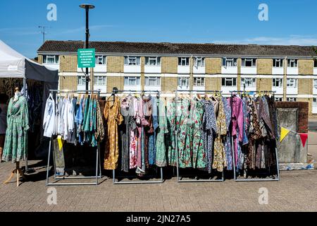 Dorking, Surrey Hills, London UK, July 07 2022, Market Stall Selling Fashionable Womens Dresses On A Clothes Hanging Rail Stock Photo