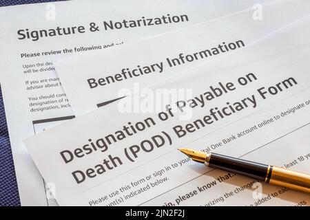 Beneficiary forms ready for signature with a fountain pen, USA Stock Photo