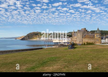 A view of Aberystwyth, The Old College, pier, promenade and funicular railway on Constitution Hill can all be seen beneath a beautiful mackerel sky. Stock Photo