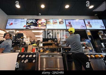 New York, USA. 08th Aug, 2022. Employees prepare orders inside a McDonald's fast-food restaurant in the New York City borough of Queens, NY, August 8, 2022. McDonald's announced that it has taken salad meals off its menu and customers have not been happy; in the past McDonald's has removed salad meals to simplify it's menu. (Photo by Anthony Behar/Sipa USA) Credit: Sipa USA/Alamy Live News Stock Photo