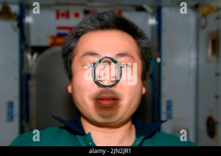 ISS - 16 June 2009 - Japan Aerospace Exploration Agency (JAXA) astronaut Koichi Wakata, Expedition 20 flight engineer, watches a water bubble float fr Stock Photo