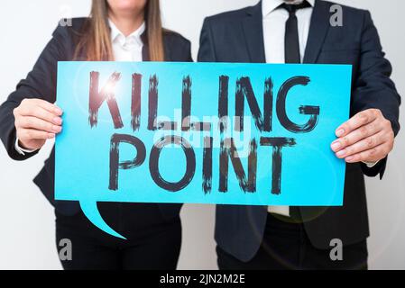 Text showing inspiration Killing Point. Word for Phase End Review Stage Gate Project Evaluation No Go Business Team Holding Important Information On Stock Photo