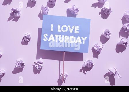 Text showing inspiration I Love Saturday. Business concept To have affection for the weekend happy excited relax Wrinkled Notes Under Piece Of Paper Stock Photo