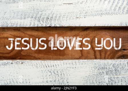 Inspiration showing sign Jesus Loves You. Conceptual photo Believe in the Lord To have faith religious person Important Informations Written On Piece Stock Photo