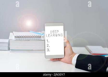 Conceptual caption Deep Learning. Word Written on Hierarchical Abstractions Artificial Intelligence Algorithm Sitting Businesswoman Holding Mobile Stock Photo