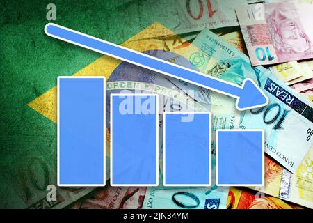 Economy Graph: Downward Arrow, Brazilian Reais Cash Bills, and Brazil Flag Stock Photo