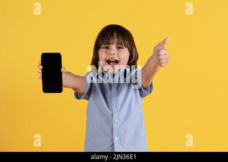Kids Gadgets Happy Excited Little Boy Pointing Smartphone Blank White Stock  Photo by ©Milkos 615784680