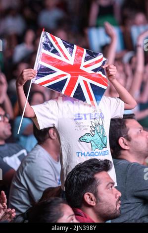 Victoria Square, Birmingham, England, August 8th 2022. - A boy waves a union flag as thousands of spectators crammed in to Victoria Square in Birmingham to watch the closing ceremony of the 2022 Commonwealth Games. Pic by Credit: Stop Press Media/Alamy Live Newsr Stock Photo