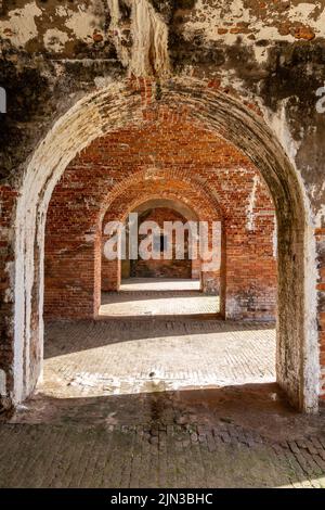 Arched brick doorways from the 1800's with lots of texture.  Concepts could include art, architecture, design, history, aging, other. Stock Photo