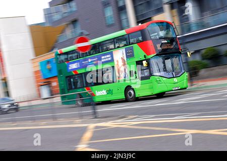 A double decker bus operated by First Bus Company seen passing throug hLeeds City Centre Stock Photo