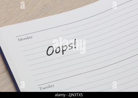 Oops diary reminder appointment open on desk Stock Photo