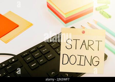Text sign showing Start Doing. Word Written on asking someone to go with action right now dont hesitate Computer Keyboard And Symbol.Information Stock Photo