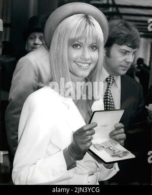 Mar. 03, 1979 - OBE For Olivia Newton-John: Australian pop singer Olivia Newton-John, star of ''Saturday Night Fever'' and ''Grease'' went to Buckingham Palace today to receive her Obe from the Queen. Photo shows Singer Olivia Newton-John seen with her OBE after the investiture at Buckingham Palace today. (Credit Image: © Keystone Press Agency/ZUMA Press Wire) Stock Photo