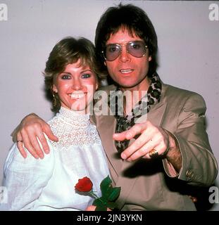 Circa 1983, London, England, United Kingdom: Singers OLIVIA NEWTON JOHN and CLIFF RICHARD. 'Suddenly' is a duet performed by Olivia Newton-John and Cliff Richard from the soundtrack 'Xanadu,' and is the love theme from the 1980 film of the same name. (Credit Image: © Globe Photos via ZUMA Wire) Stock Photo