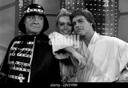 December 19, 1977, Hollywood, California, USA: (L-R) Actors BOB HOPE, OLIVIA NEWTON JOHN and MARK HAMILL do a spoof on ''STAR WARS'' during the NBC Bob Hope 1977 Christmas Special. (Credit Image: © Courtesy NBC/Globe Photos/ZUMA Wire) Stock Photo