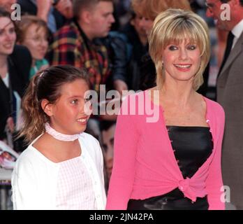File photo dated 25/06/98 of Olivia Newton-John arrives with her daughter Chloe, for the premiere of the 20th anniversary re-issue of the musical Grease, at the Empire, Leicester Square, London. Dame Olivia Newton-John has died at the age of 73, her widower has confirmed. The British-born singer died 'peacefully' at her ranch in Southern California on Monday morning, surrounded by family and friends. Issue date: Tuesday August 9, 2022. Stock Photo