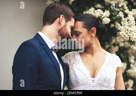 Youre all Ive ever needed in this life. a happy newlywed young couple posing together on their wedding day. Stock Photo