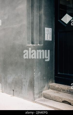 A vertical shot of a smooth concrete wall of a house Stock Photo