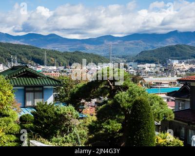 Chino, Nagano prefecture, Japan - October 22, 2017: View of the town of Chino from Suwa Taisha Kamisha Maemiya, the oldest shrine within Suwa Taisha c Stock Photo