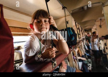 A young girl is seen on the evacuation train to Dnipro. Amid the intensified fighting in the Eastern part of Ukraine, east Ukraine is now intensifying its civilian evacuation, as millions of Ukrainian families have been evacuating from the closer and closer war, as many of them will be relocated to the western part of the country. According to the United Nations, at least 12 million people have fled their homes since Russia's invasion of Ukraine, while seven million people are displaced inside the country. Stock Photo