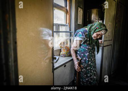 August 6, 2022, Donetsk Oblast, Donets'ka Oblast'', Ukraine: An old lady can be seen on the evacuation train to Dnipro. Amid the intensified fighting in the Eastern part of Ukraine, east Ukraine is now intensifying its civilian evacuation, as millions of Ukrainian families have been evacuating from the closer and closer war, as many of them will be relocated to the western part of the country.According to the United Nations, at least 12 million people have fled their homes since Russia's invasion of Ukraine, while seven million people are displaced inside the country. (Credit Image: © Alex Stock Photo