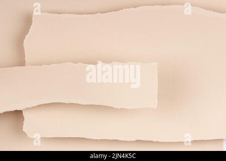 Torn paper textured collage background. Grunge ripped pastel paper pieces with ragged edge paper background. Top view, copy space Stock Photo