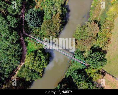 Aerial view of a footbridge over the River Derwent near Malton in the North Yorkshire countryside, northeast England. Stock Photo