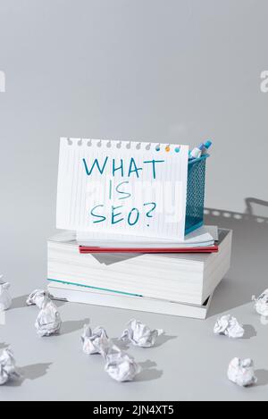 Sign displaying What Is Seo. Internet Concept Search Engine Keywording Marketing Online searching Strategies Important Idea Shown On Note On Desk With Stock Photo