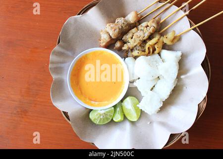 sate taichan or taichan satay , made from chicken meat, served with Sauce, Ketchup and lime. this food like yakitori Stock Photo