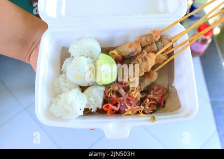 sate taichan or taichan satay , made from chicken meat, served with Sauce, Ketchup and lime. this food like yakitori Stock Photo