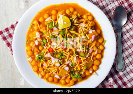 selective focus of delicious Bengali street food 'Ghugni' made of chickpeas. with a marble background. Stock Photo