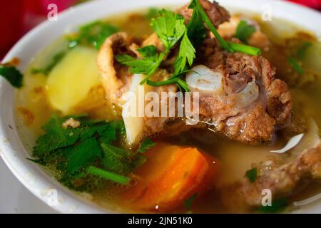 sop buntut or oxtail soup or tail soup is traditional soup made from tail ox, Boiled with Spices Stock Photo