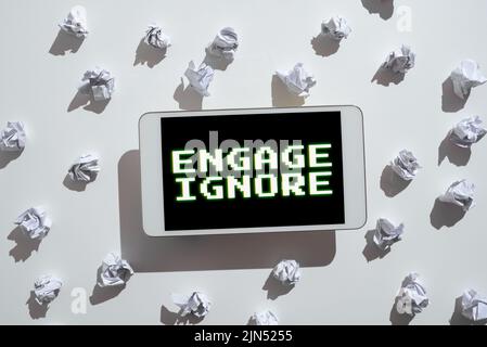 Handwriting text Engage Ignore. Business overview Silent Treatment Manipulative Punishment Sulking Shunning Paper Wraps Placed Around Tablet With Stock Photo